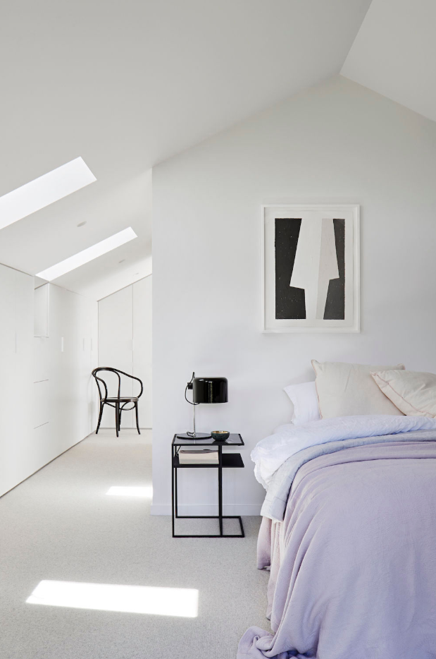 Minimalist interior by Robson Rak with restrained palette and strong natural light. Photo: House Beautiful