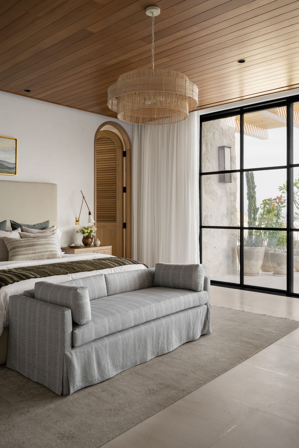 California coastal bedroom by Studio McGee with linen and natural wood. Photo: House Beautiful