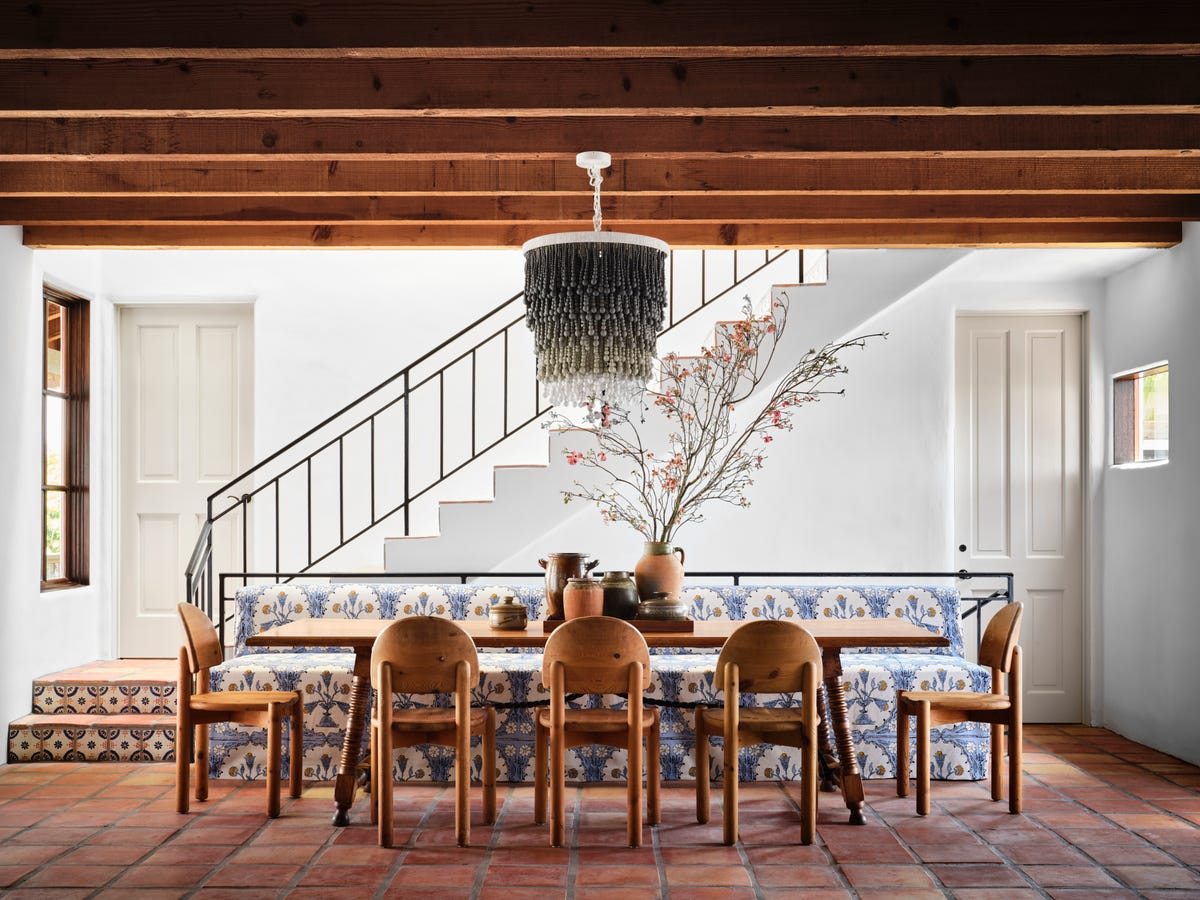 Mediterranean dining area with antique Spanish table. Photo: House Beautiful