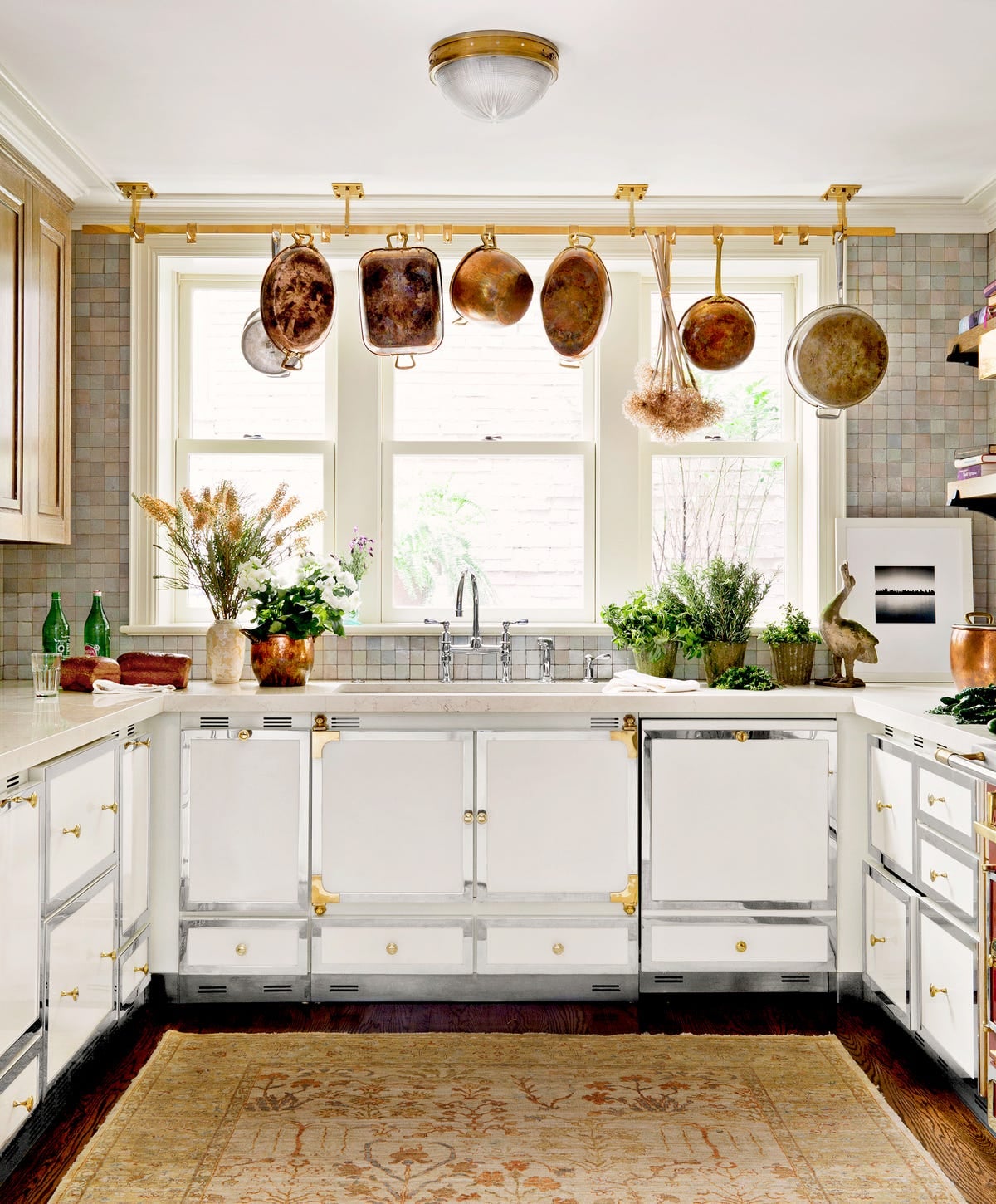 French country kitchen with hanging copper pots. Photo: House Beautiful