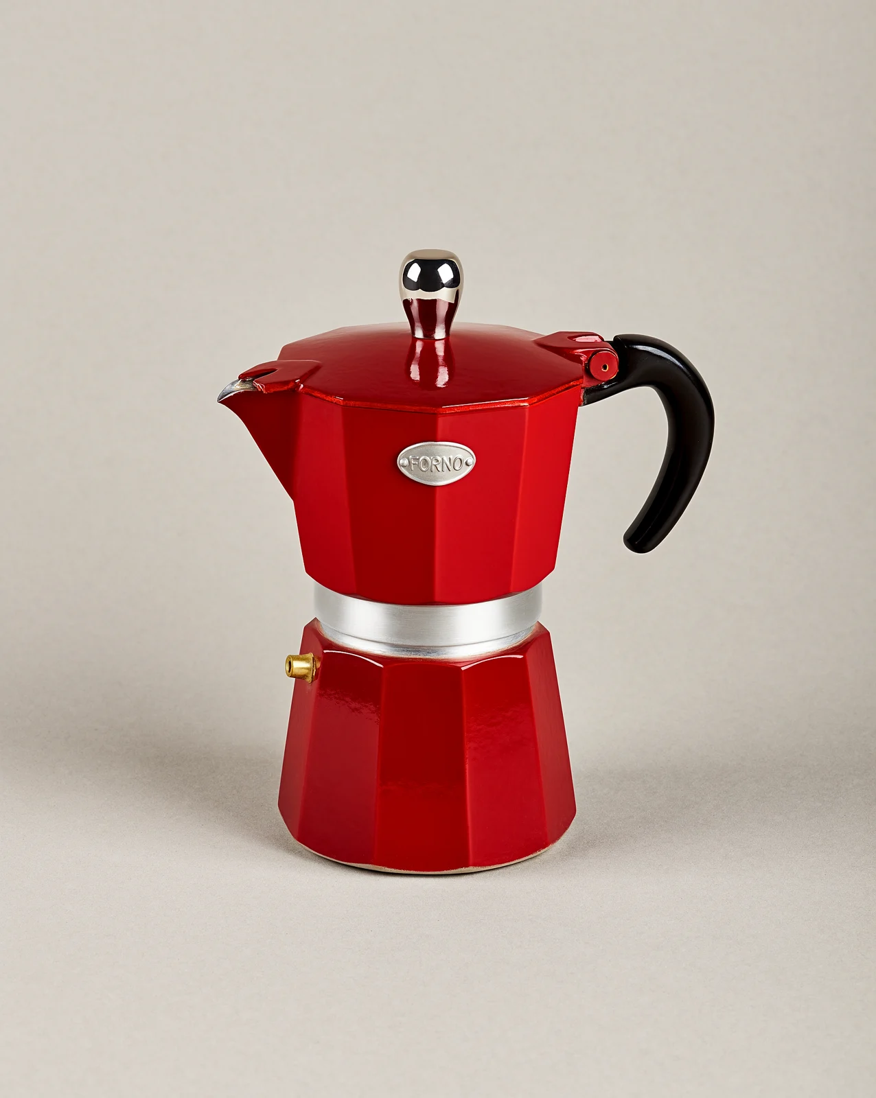 Red enamel moka pot on a plain background