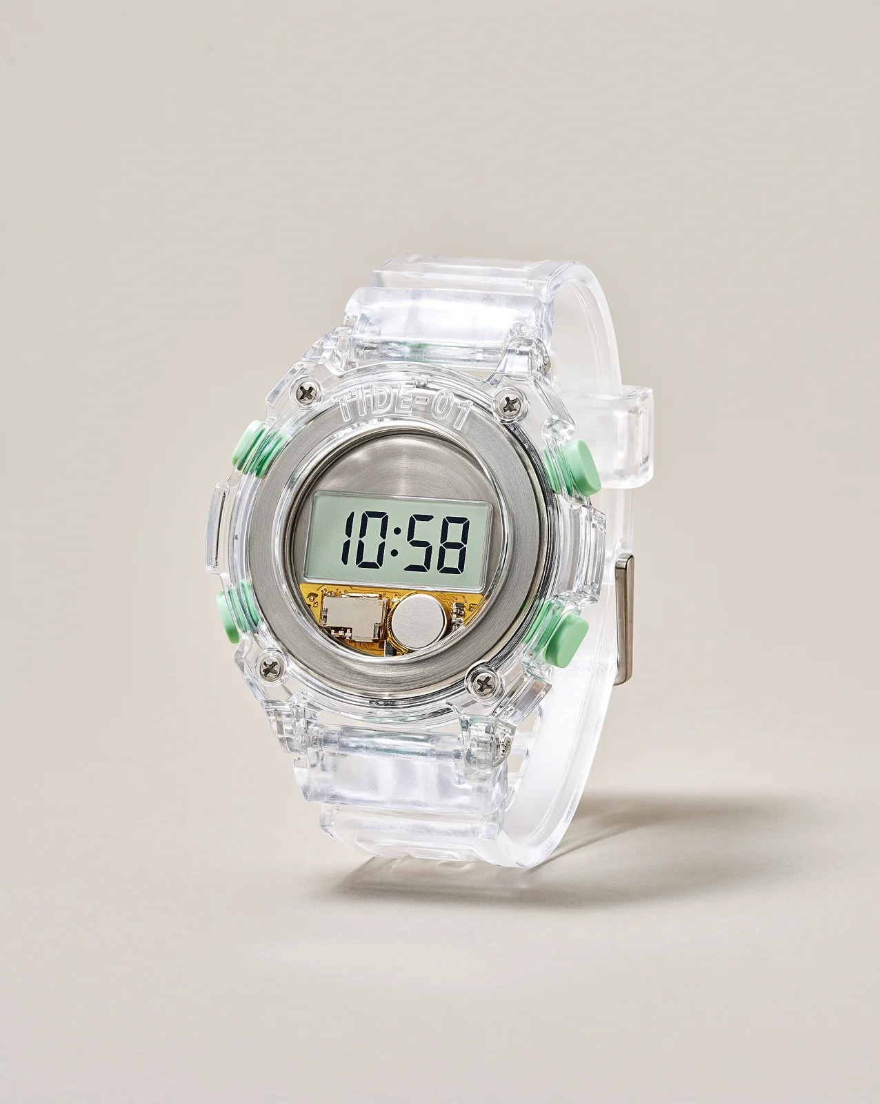 Clear plastic digital watch on a plain background