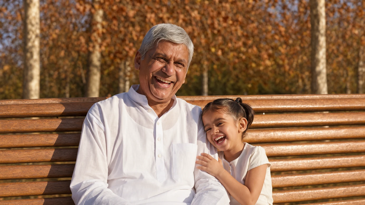 Grandfather and granddaughter photo expanded to the full park bench